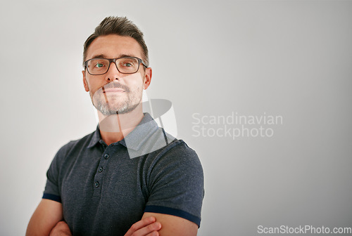 Image of Mature man, thinking and gray wall background with ideas, brainstorming and glasses with mockup space. Guy, focus and arms crossed with idea, mindset and smile for vision, pride or career by backdrop