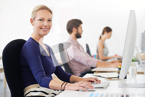 Image of Portrait, happy and business woman, creative designer or employee in startup company on computer. Face, entrepreneur or design professional with pride for career, job or success mindset for coworking