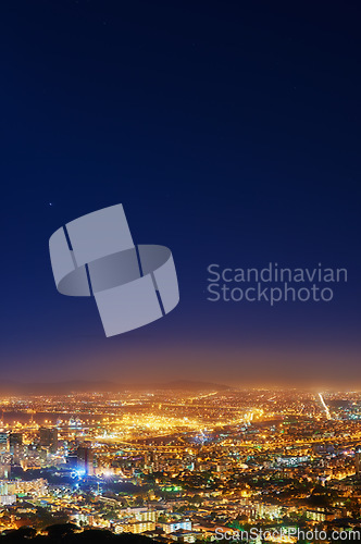 Image of Night, sky and city with lights, buildings and Cape Town with view, traffic and urban development. Future, cloud and industry with growth, transportation and landscape with streets, dark and travel