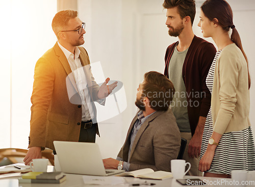 Image of Meeting, leadership and training with a manager talking to his team in the office for upskill training. Planning, strategy and collaboration with a business man teaching his employee staff at work