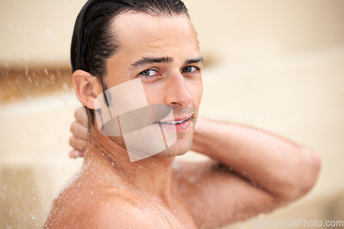 Image of Man, shower and water drop in portrait, bathroom and hygiene with self care, morning and skin routine in home. Young guy, body cleaning and healthy for skincare, wellness and cosmetics in apartment