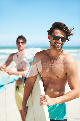 Image of Beach, summer and man surfing friends outdoor together for travel, vacation or holiday trip overseas. Surf, sea or fun with a young male surfer in sunglasses and friend bonding on an ocean coast