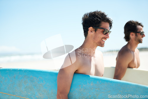 Image of Beach, summer and man surfer friends bonding outdoor on vacation or holiday travel overseas. Surf, sea or fun with a happy young male and friend in sunglasses surfing together on an ocean coast