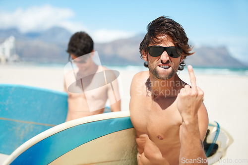Image of Beach, middle finger and man surfing friends outdoor together for summer vacation or holiday trip overseas. Surf, sea or rude with a young male surfer in sunglasses and friend bonding at the coast