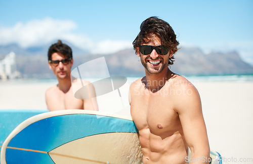 Image of Beach, sea and man surfing friends outdoor together for travel, vacation or holiday trip overseas. Surf, summer or fun with a young male surfer in sunglasses and friend bonding on an ocean coast