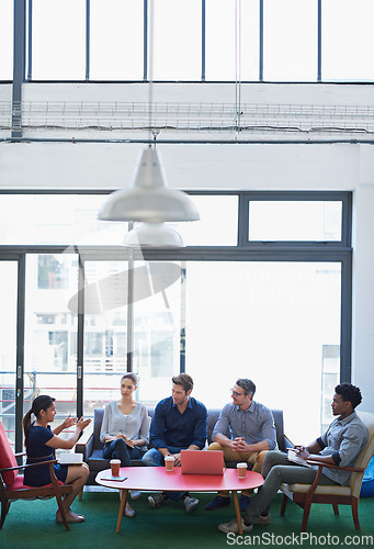 Image of Business, group and staff in a meeting, talking and collaboration with partnership, teamwork and creativity. Team, men or women share ideas, discussion or planning with conversation and modern office