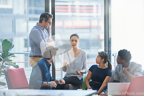 Image of People in creative meeting, brainstorming and teamwork in project management at business agency. Communication, collaboration and group strategy, men and women talk about design process at startup