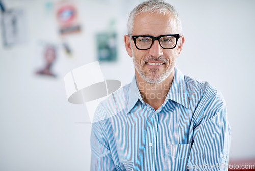 Image of Portrait, glasses and management with a business man in the office for corporate or professional work. Face, eyewear and leadership with a senior manager or CEO in a workplace on a blurred background