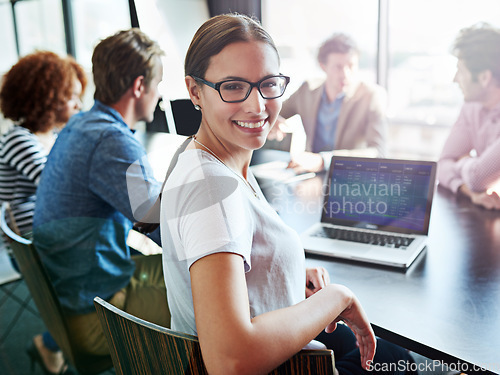 Image of Smile, portrait and a woman in a meeting with a laptop for planning, teamwork or work agenda. Happy, corporate and lawyers in a boardroom for business training, workshop or seminar together in office