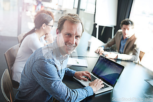 Image of Smile, meeting and portrait of a businessman with a laptop for notes, email or planning at work. Expert, teamwork and a corporate worker typing on a pc for project management collaboration in office