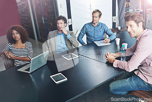 Image of Professional, group and listen in meeting or conference room for collaboration or learning at office. Meeting, focus and teamwork at presentation for project at a startup for creative plan with tech.