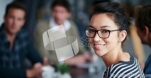 Image of Woman leader, portrait and startup team in blurred background, meeting and smile with confidence. Young businesswoman, leadership and happy with group, workplace or creativity in collaboration at job