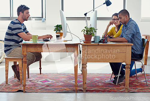 Image of Coworking staff, creative designer and team in office with work and collaboration of small business. Startup, teamwork and tech in a workplace with communication of group with graphic design project