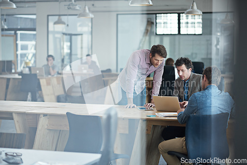 Image of Mentorship, teamwork or business people in startup planning to design a project for collaboration. Laptop, online or manager training, teaching or coaching employees for digital research behind glass