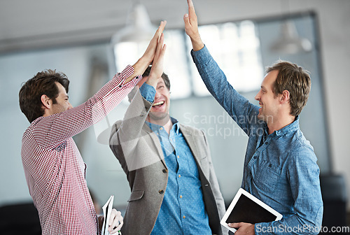 Image of Success, winners or excited business people high five after a winning a deal or group partnership achievement. Teamwork, startup or happy employees in celebration together with support or solidarity