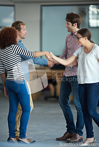 Image of Handshake, success or business people in startup for collaboration, support or deal agreement. Group of men, happy women or team of creative employees shaking hands in a partnership or negotiation