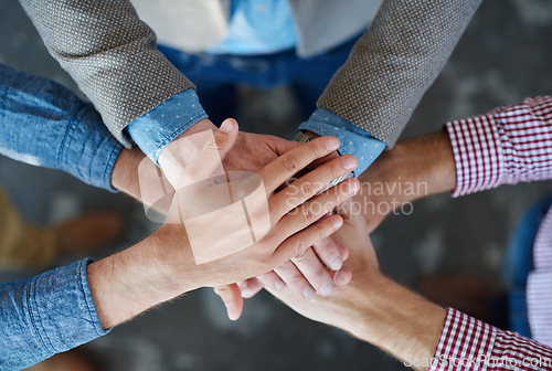 Image of Teamwork, top view and hands together for cooperation, team building or solidarity. Collaboration, hand huddle and group of people with motivation, trust or support for community goals in partnership