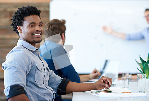 Image of Business meeting, portrait and happy black man listening to presentation, manager report or leader speech. Confident smile, happiness and corporate people, group or African person working on project