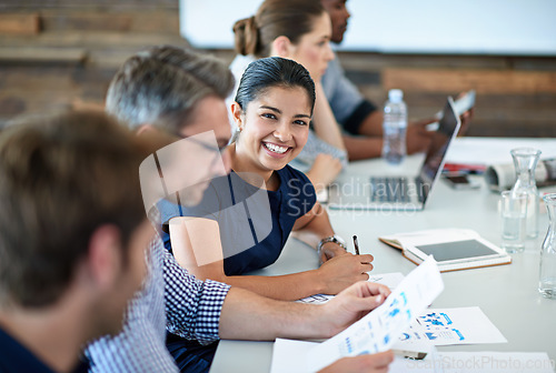 Image of Portrait, happy and a business woman in the boardroom with her team during a meeting for planning. Smile, strategy or collaboration with a female employee and colleagues in the office for a workshop