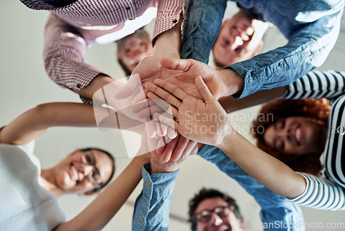 Image of Portrait, business and group with hands together, stack and cooperation with collaboration, teamwork and partnership. Face, staff or team building with support, solidarity and motivation with success