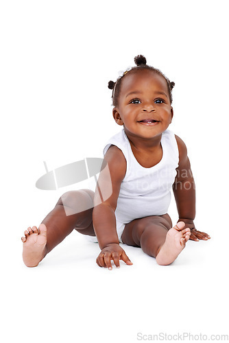 Image of Smile, sitting and African girl baby isolated on white background with playful happiness and growth. Learning, playing and laughing, happy black kid on studio backdrop for development and child care.