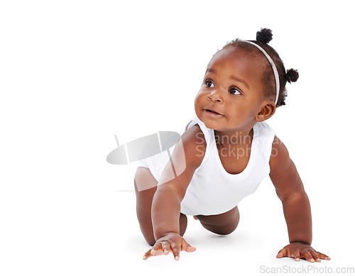 Image of Isolated, baby crawling and against a white background on the floor. Childhood or milestone, child development or playing and black toddler crawl alone against a studio backdrop on the ground