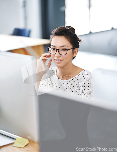 Image of Thinking, computer and business woman in office for research, website and designer. Focus, entrepreneur and creative with female employee in digital agency for technology, professional and startup