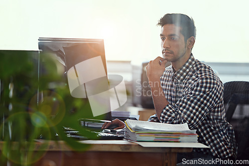 Image of Computer, focus and business man in office for research, creative and planning. Thinking, professional and technology with male employee on digital agency for startup, email and website designer