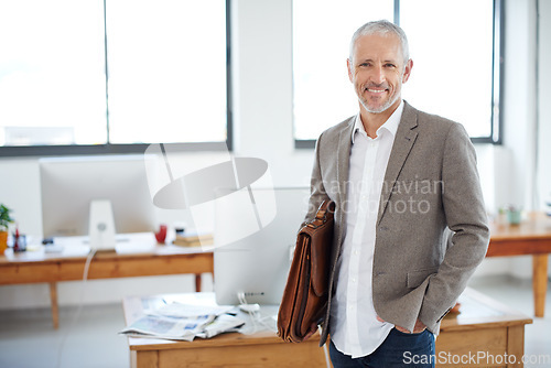 Image of Senior business man, portrait and executive at creative startup with smile, confidence and modern office. CEO, success and career mindset, happy male professional in management at advertising company