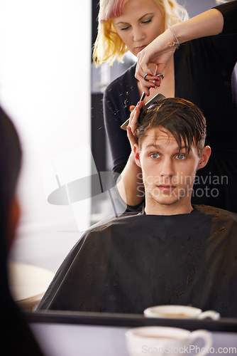 Image of Hair studio, hairstylist and mirror reflection of man for hairstyle, grooming and cleaning in beauty spa salon. Hairdresser, service woman and studio people, customer or person for texture haircut