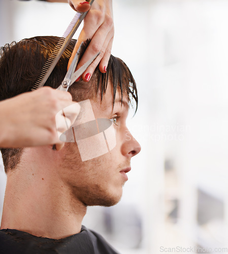 Image of Hair scissors, man and hairdresser hands cutting hairstyle, grooming and cleaning in studio salon. Hairdressing cosmetic tools, stylist service or profile of people, customer or client for treatment