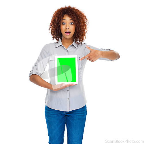 Image of Woman, point and green screen tablet in studio for social media app, review and mockup by white background. Isolated african lady, model and touchscreen for web design job, space and surprise face