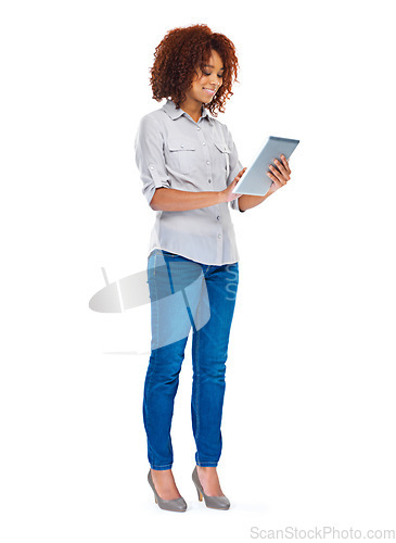 Image of Isolated woman, texting and tablet in studio for social media app, contact and communication by white background. Young african lady, model and touchscreen for web design job, smile and connectivity