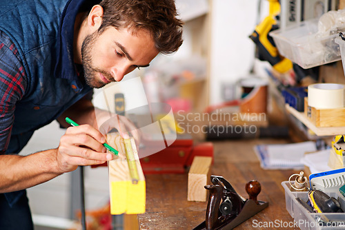 Image of Man, focus wood and tape measure for construction, home development and building renovation. Carpenter, maintenance employee and male repairman worker on a contractor job of builder working in house