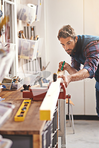 Image of Man, workshop and tape measure for construction, home development and building renovation. Carpenter, maintenance employee and male repairman worker on a contractor job of builder working in house