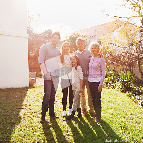 Image of Hug, outdoor portrait and happy family grandparents, parents and child bonding, smile and together in backyard lawn. Happiness, solidarity and reunion people enjoy summer sunshine, love and support