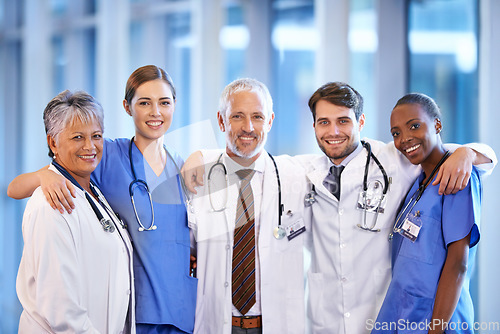 Image of Healthcare, team and portrait of doctors and nurses standing in a corridor of the hospital. Confidence, diversity and happy professional medical workers with smile in collaboration in medicare clinic