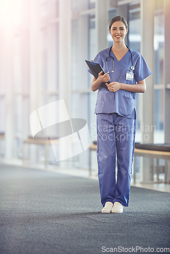 Image of Female nurse, portrait and stethoscope with chart at the hospital for results or details for surgeon. Clipboard, nursing and healthcare at a medical centre with smile in the hallway with notes.