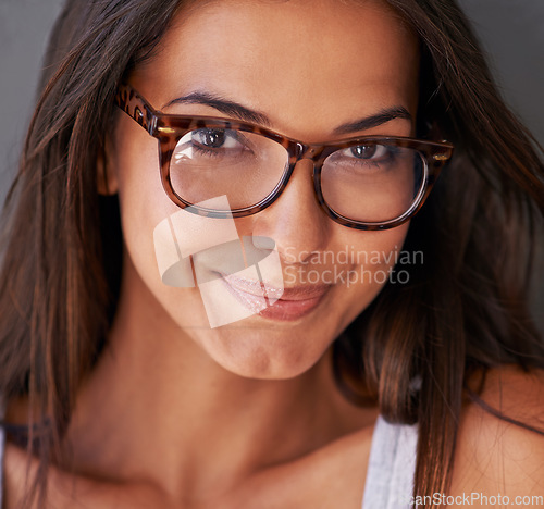 Image of Woman, face and smile with glasses and eye care, vision with designer frame and prescription lens. Portrait, healthcare and female model with fashion eyewear, eyes with optometry and closeup