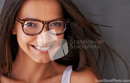 Image of Woman, face and happy with glasses and eye care, vision with designer frame with prescription lens. Portrait, healthcare and female model with smile and fashion eyewear, optometry and health for eyes