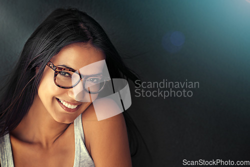 Image of Woman, face and happy with glasses and vision with designer frame with prescription lens on studio background. Portrait, eye care and female model with fashion eyewear, optometry and mockup space