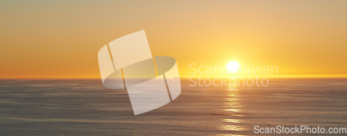 Image of Orange sky, sunset and sea at morning on the horizon with ocean and waves landscape. Sunrise background, calm weather and summer by beach with coastline and outdoor environment with sun and mockup