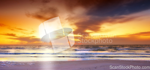 Image of Sky, sunset and sea at morning on the horizon with ocean and water waves landscape. Sunrise, calm weather and summer by the beach with coastline and outdoor environment with the sun in nature