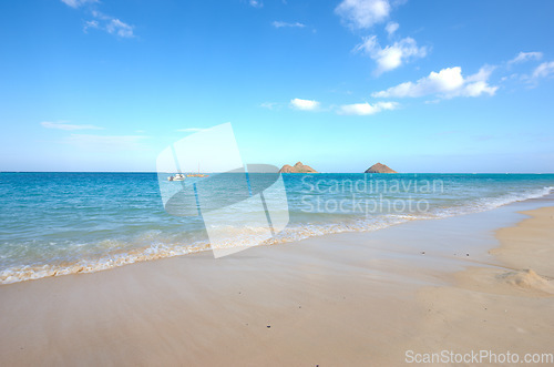 Image of Water, beach and ocean landscape with clouds in the sky or travel to a tropical paradise, dream vacation or island holiday mockup space. Hawaii in summer, wallpaper and blue sea waves on sand