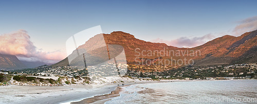 Image of Mountain, nature and city by ocean in South Africa for tourism, traveling and global destination. Landscape, background and scenic view of beach by urban town for adventure, vacation and holiday