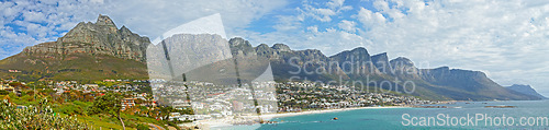 Image of Mountain, travel and city by ocean in South Africa for tourism, traveling and global destination. Landscape, background and scenic view of beach by urban town for coastline, vacation and holiday