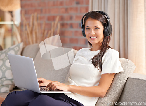Image of Headphones, laptop and portrait of a woman student on home sofa listening to music or streaming online. Happy female person smile, relax and learn new language with internet connection and tech