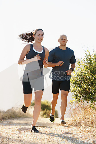 Image of Mountain, fitness and coach trail running with woman as workout or morning exercise for health and wellness. Sport, man and runner run with athlete as training in nature for sports or energy together