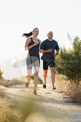 Image of Morning, fitness and couple trail running as workout or morning exercise for health and wellness together. Sport, man and woman runner run with athlete as training in nature for sports or energy