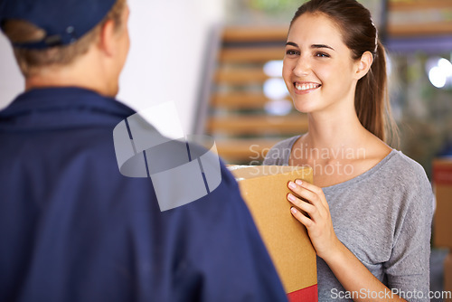 Image of Delivery, shipping and courier with woman at door for logistics, cargo and supply chain. Ecommerce, package and export with man giving customer box at home for distribution, freight and retail